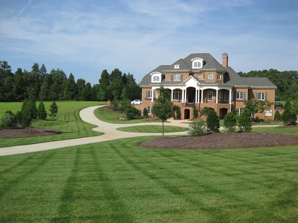 Freshly Mowed, Seeded and trimmed Lawn of big home